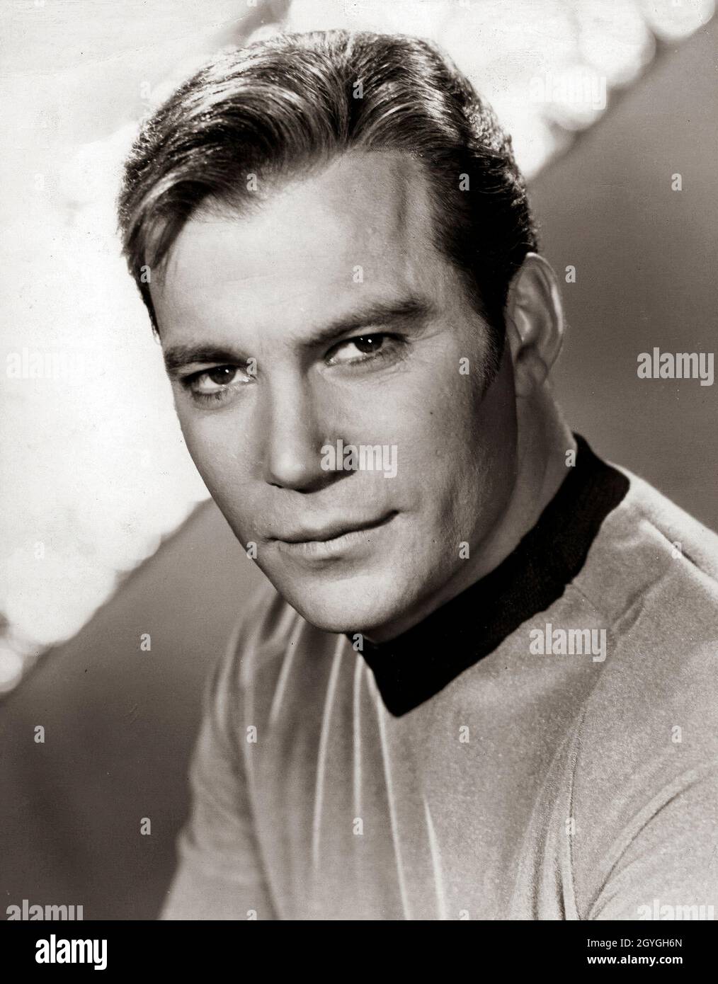 William Shatner as Star Trek's Captain Kirk. William Shatner OC (born March 22, 1931) is a Canadian actor, author, producer, director, screenwriter, and singer. In his seven decades of acting, he became a cultural icon for his portrayal of Captain James T. Kirk of the USS Enterprise in the Star Trek franchise. He has written a series of books chronicling his experiences playing Captain Kirk, being a part of Star Trek, and life after Star Trek. Stock Photo