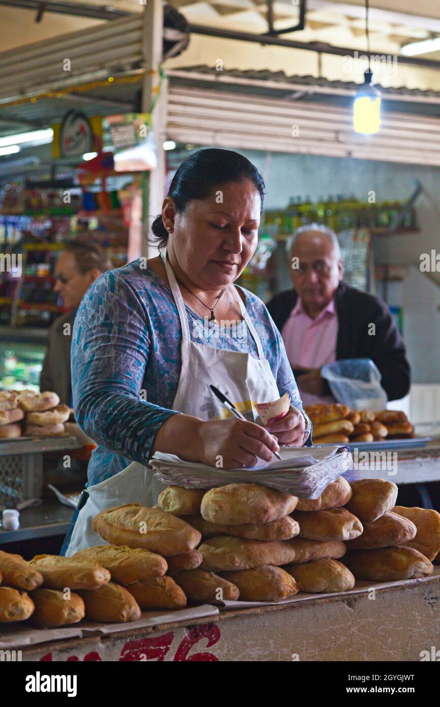 A baker with her bread in TLAQUEPAQUE - GUADALAJARA, MEXICO Stock Photo