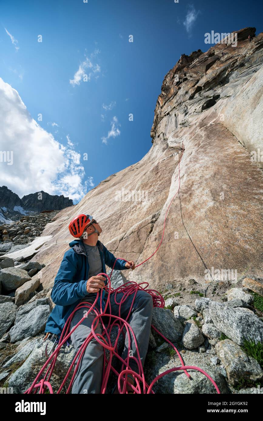 Pulling down the rope after descending at Hannibalturm near Furkapass, Switzerland Stock Photo