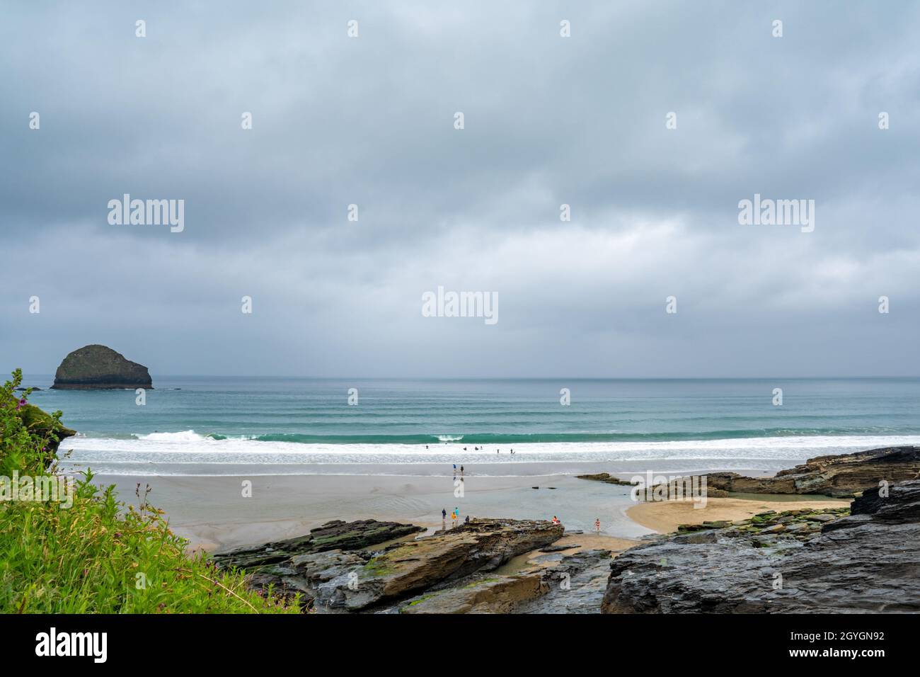A very tranquil Trebarwith Strand beach in North Cornwall with gentle surf coming in. Stock Photo
