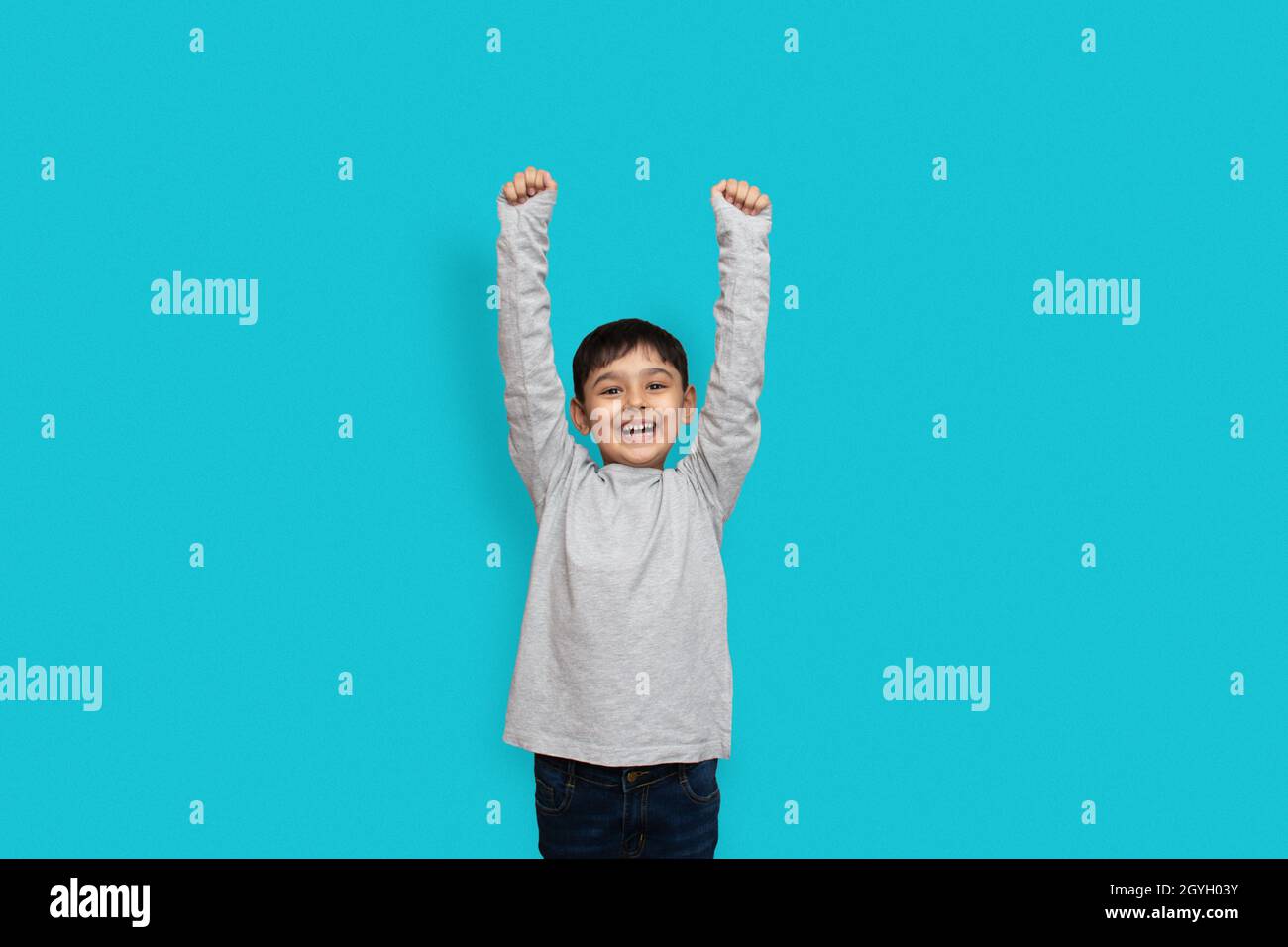 Surprise, excitement and fascination concept. Pakistani Asian little boy shocked with astonishing unexpected news, having amazed look Stock Photo