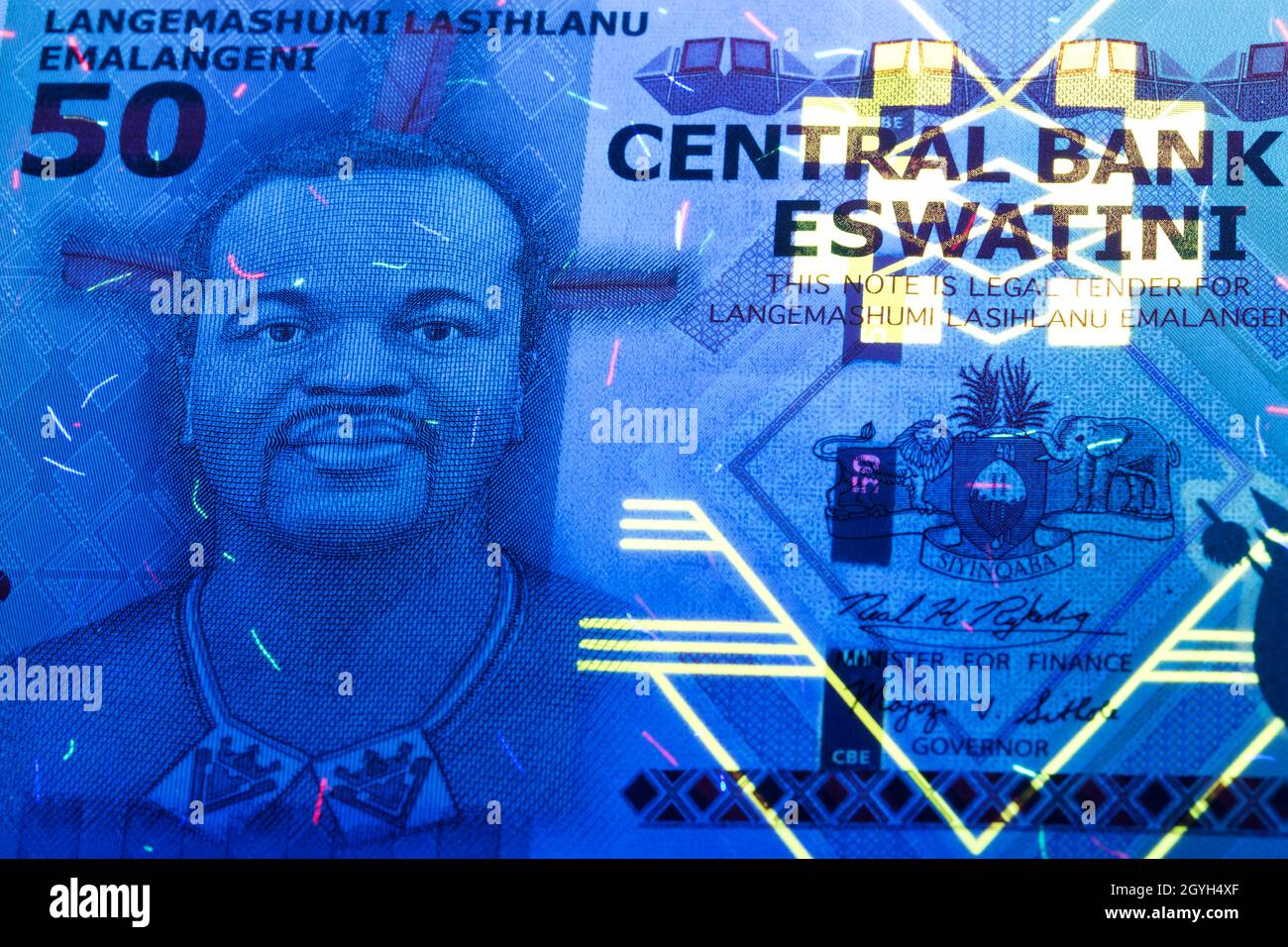 Suazi money in UV rays Stock Photo