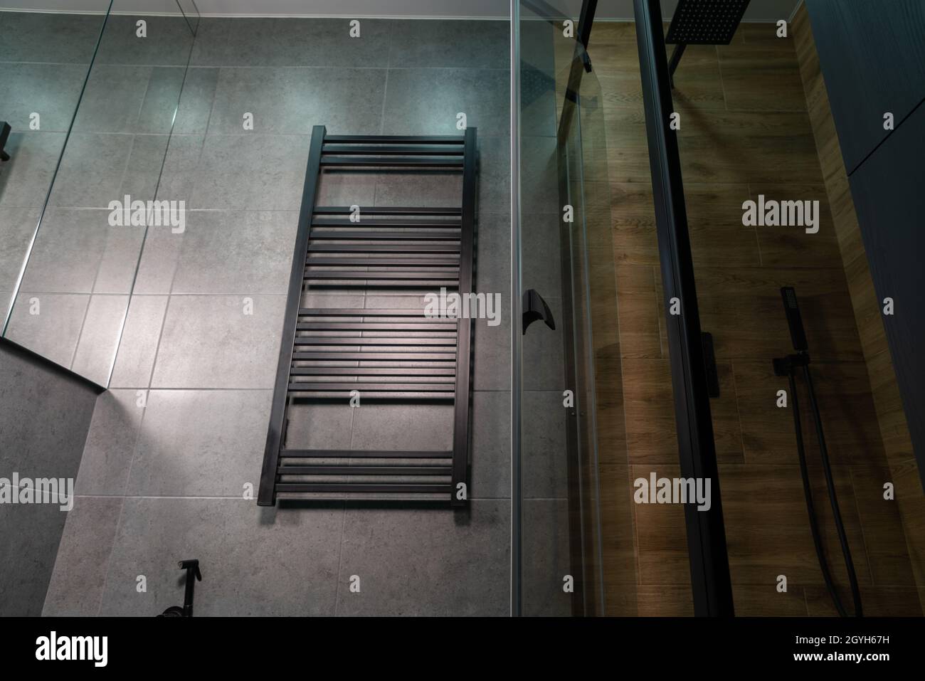 Low angle view of a wallmounted heated towel rail in a bathroom with