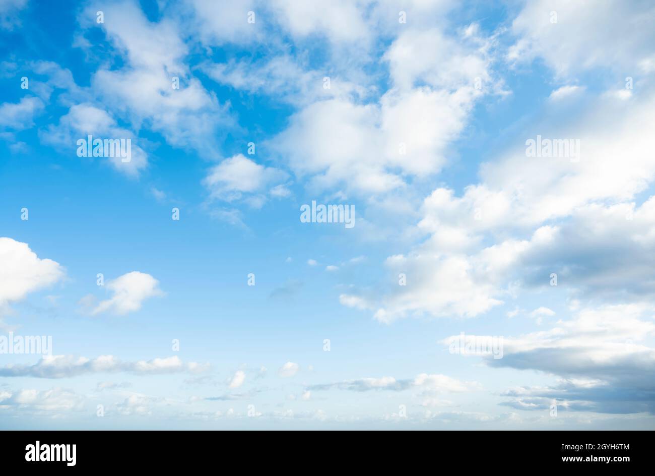 Stunning view of a blue sky with some fluffy clouds during a sunny day ...