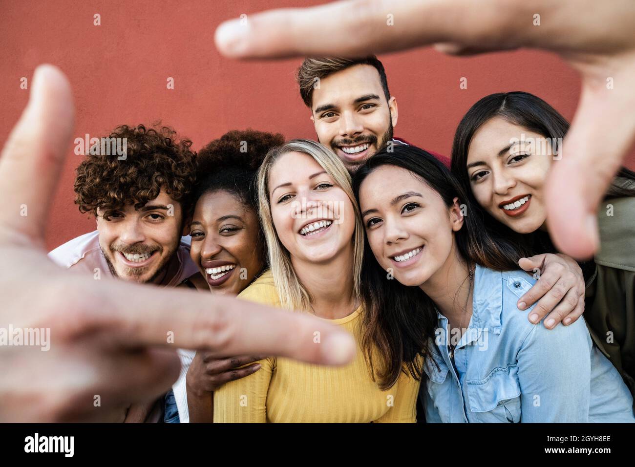 Happy multiracial friends having fun outdoor - Focus on center girl ...