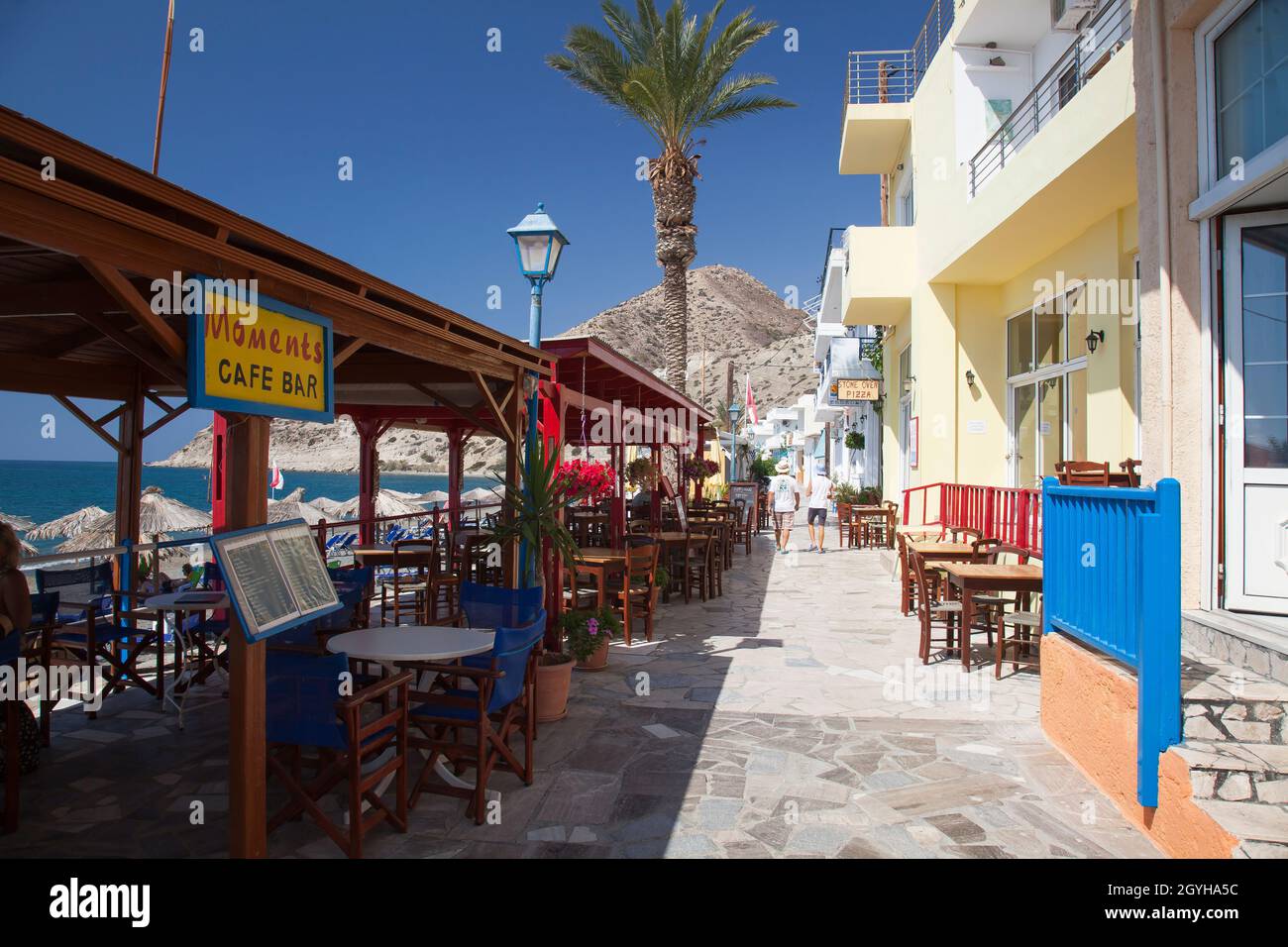 Promenade with Restaurants on the beach of Myrtos, South Coast, Crete, Greece, Europe                   Promenade with Restaurants on the beach of Myr Stock Photo