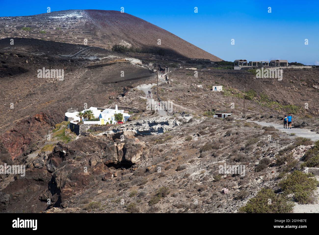 Hikers hike along the crater hiking trail, Santorini, Cyclades, Greece, Europe Stock Photo