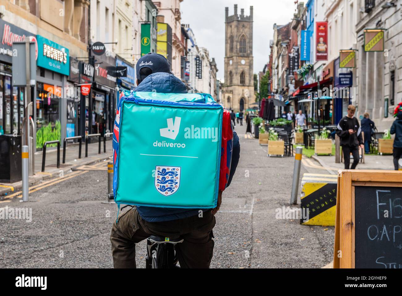 Deliveroo rider in the Bold Street food quarter, Liverpool, Mersyeside, UK. Stock Photo