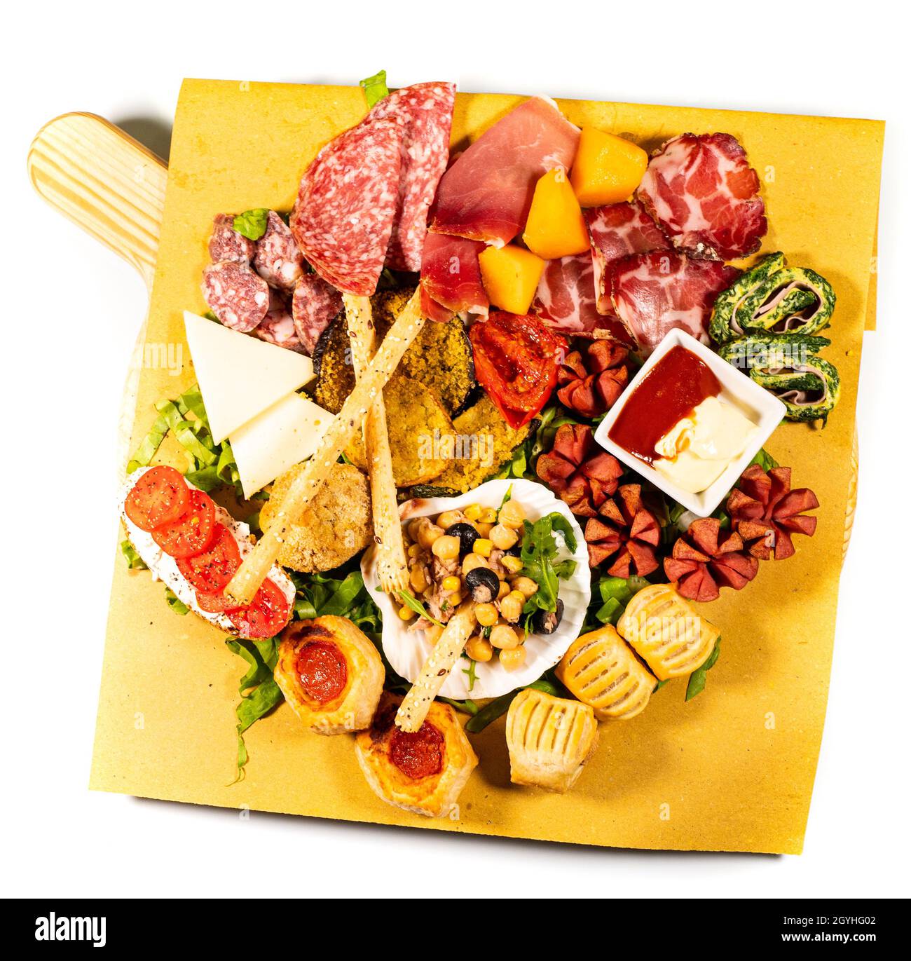 mixed antipasto platter with cold cuts and legumes and cheeses on a