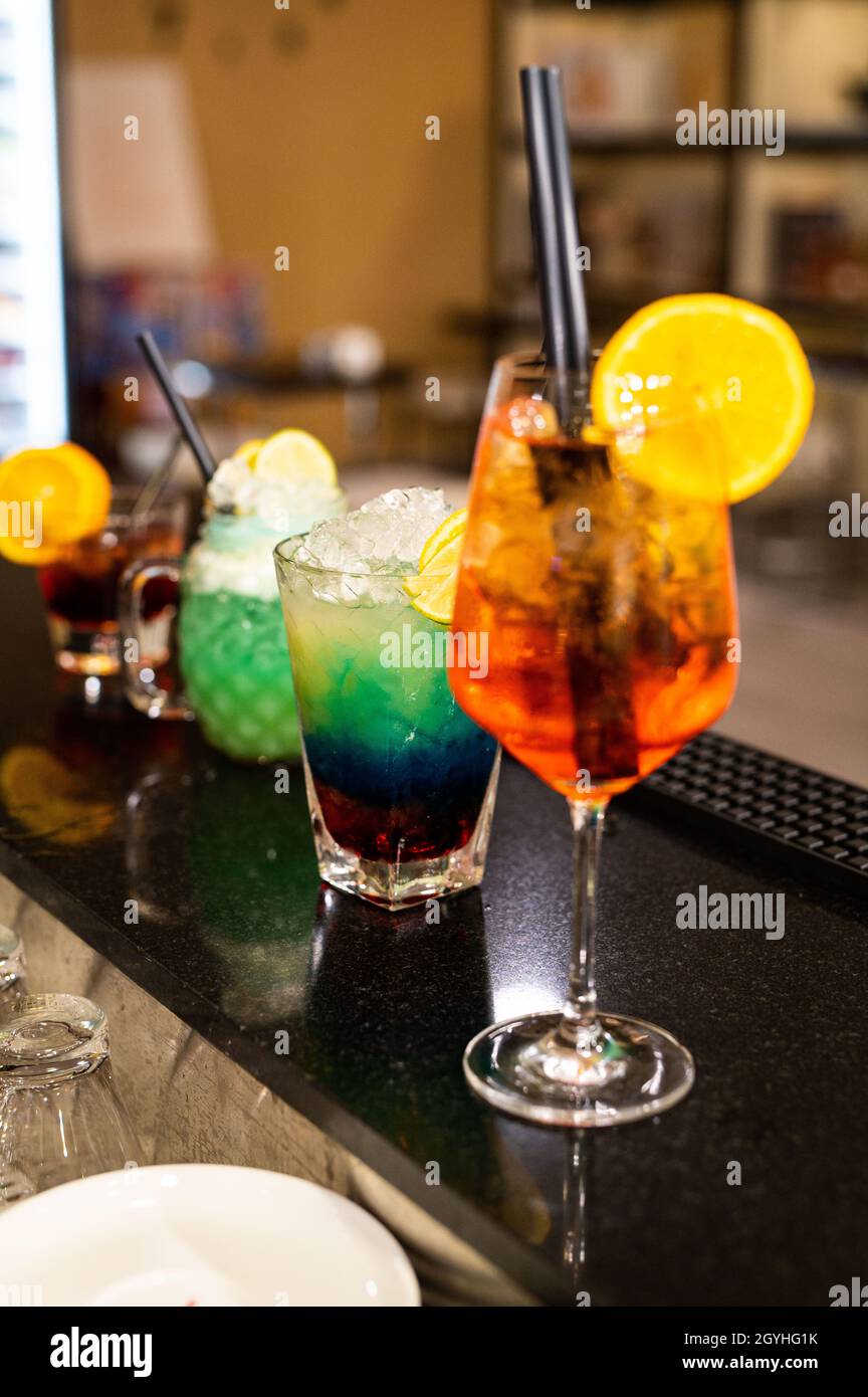 composition of various cocktails on the counter in strong colors and ...