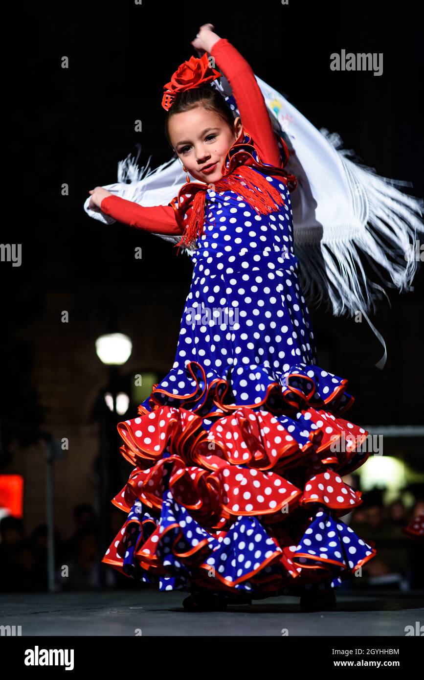 Little girl in traditional costume dress performing a spanish flamenco dance  on the stage Stock Photo - Alamy