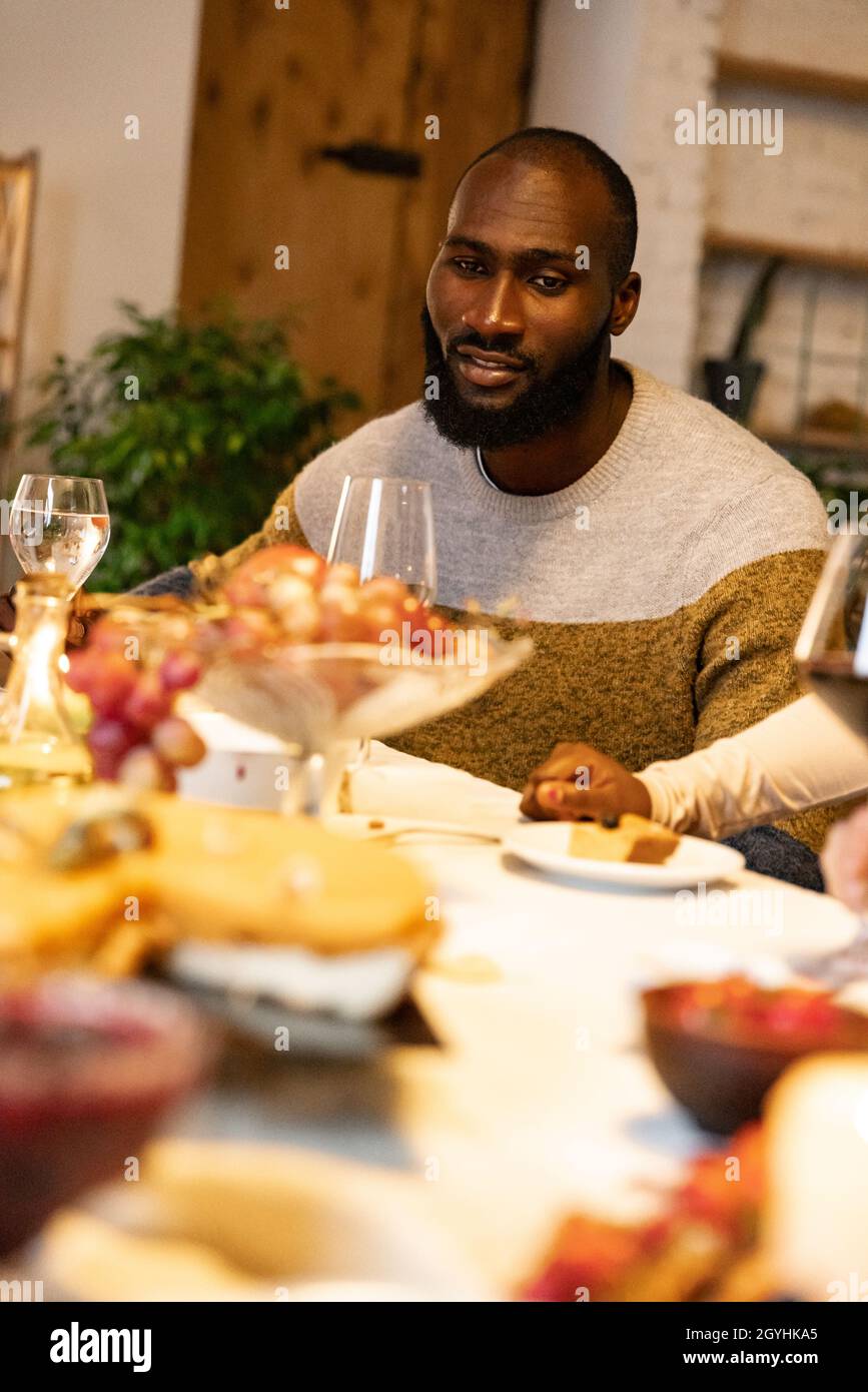 Portrait of young african man celebrates with friends happy