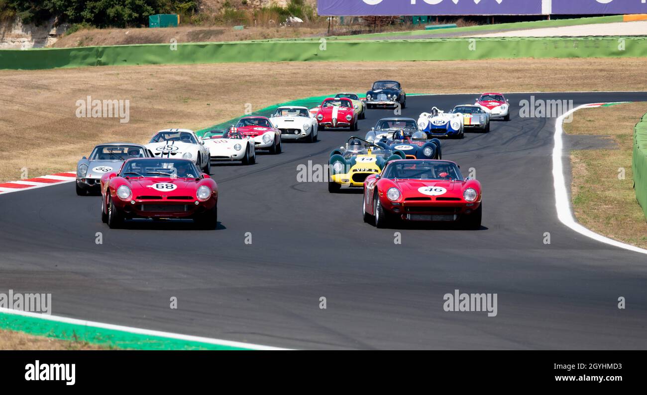 Italy, september 11 2021. Vallelunga classic. 60s vintage race cars large group competition on racetrack, formation lap with Porsche, Ferrari, Alfa Ro Stock Photo