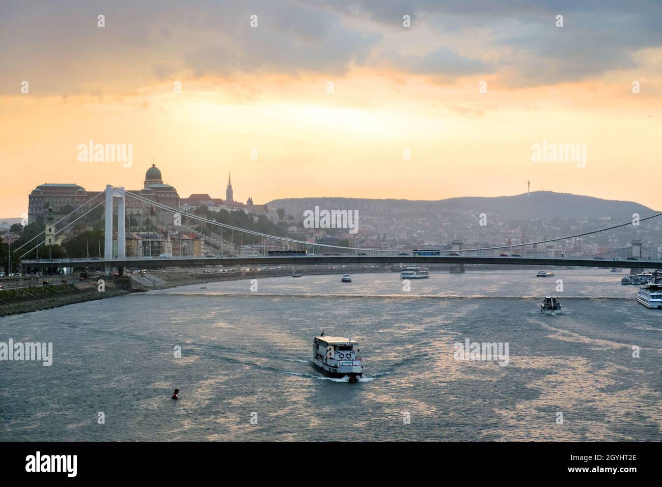 Sunset over the river. Sightseeing boat against Budapest view Stock Photo
