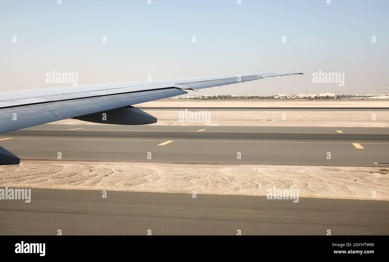 Wing of a plane during takeoff. Stock Photo