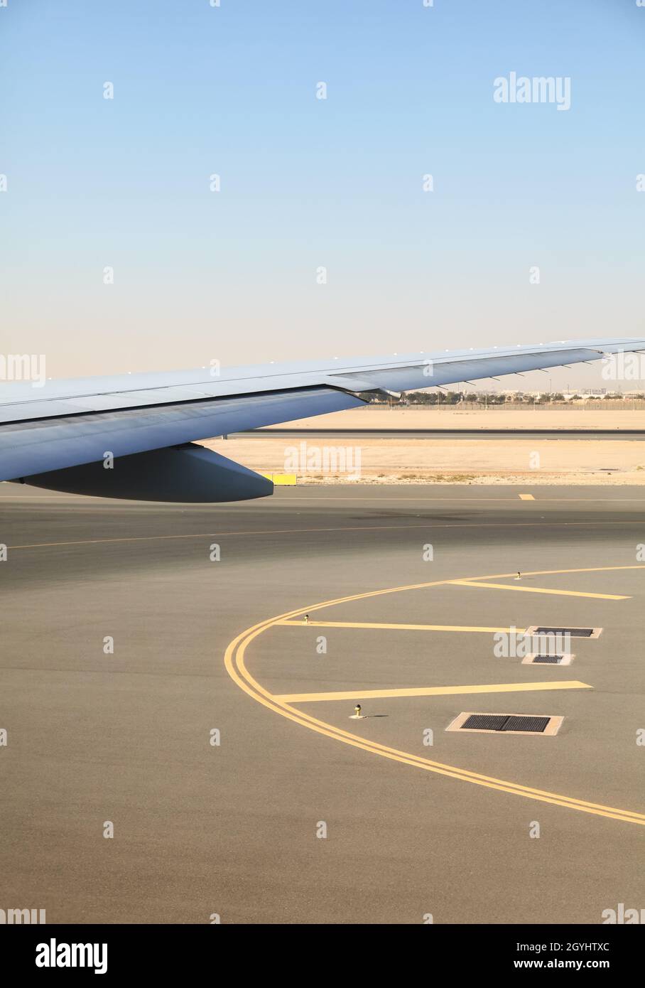 Wing of a plane during takeoff. Stock Photo