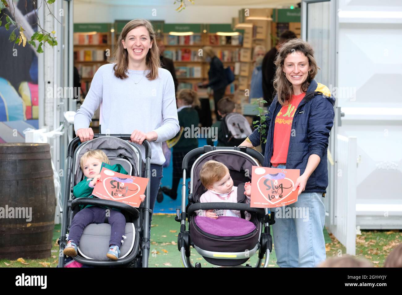 Cheltenham Literature Festival, Cheltenham, UK - Friday 8th October 2021 - Young visitors show off their picture books on the opening day of the Cheltenham Literature Festival - the Festival runs for 10 days. Photo Steven May / Alamy Live News Stock Photo