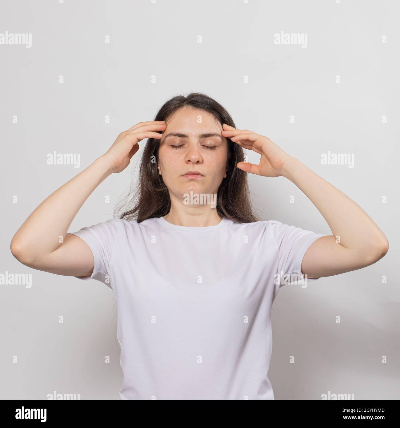 Meditating hands on temples hi-res stock photography and images - Alamy