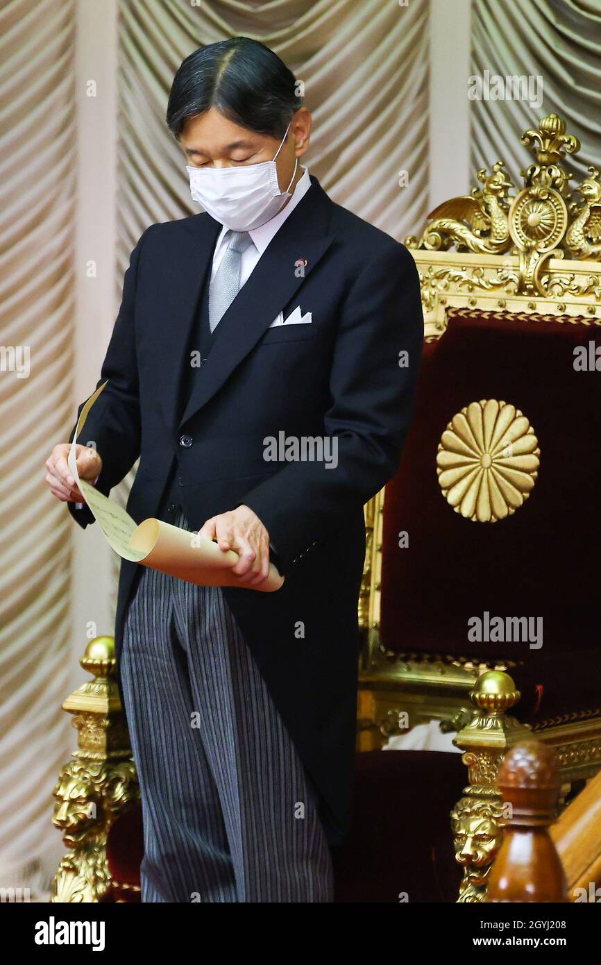 Japan's Emperor Naruhito wearing a face mask, declares the opening of ...