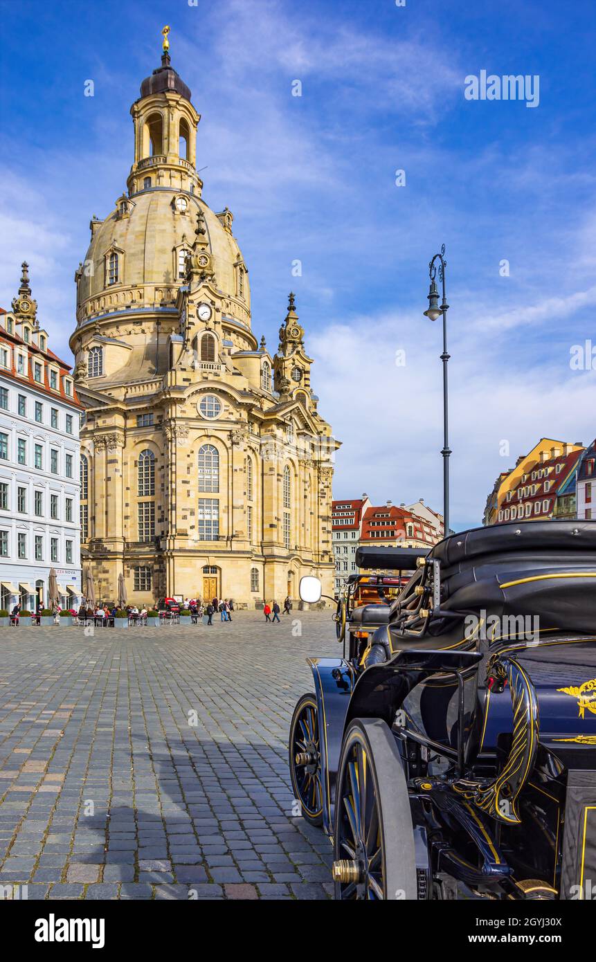 Dresden, Saxony, Germany: An e-car for city tours waits for passengers on Neumarkt Square in front of Frauenkirche Church. Stock Photo