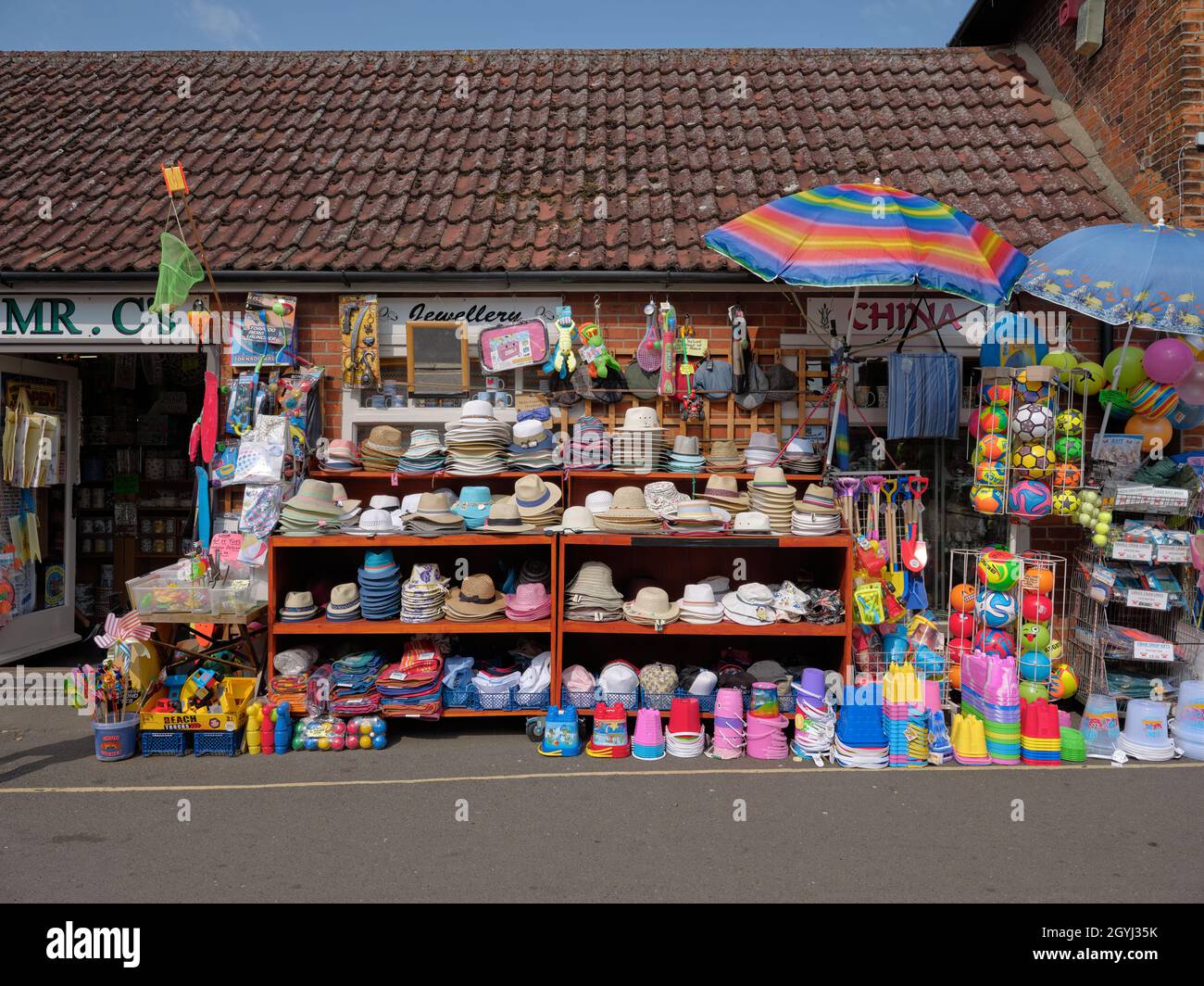 Colourful tourist and beach accessories shop display in Wells Next To The Sea on the North Norfolk Heriitage Coast in Norfolk England UK Stock Photo