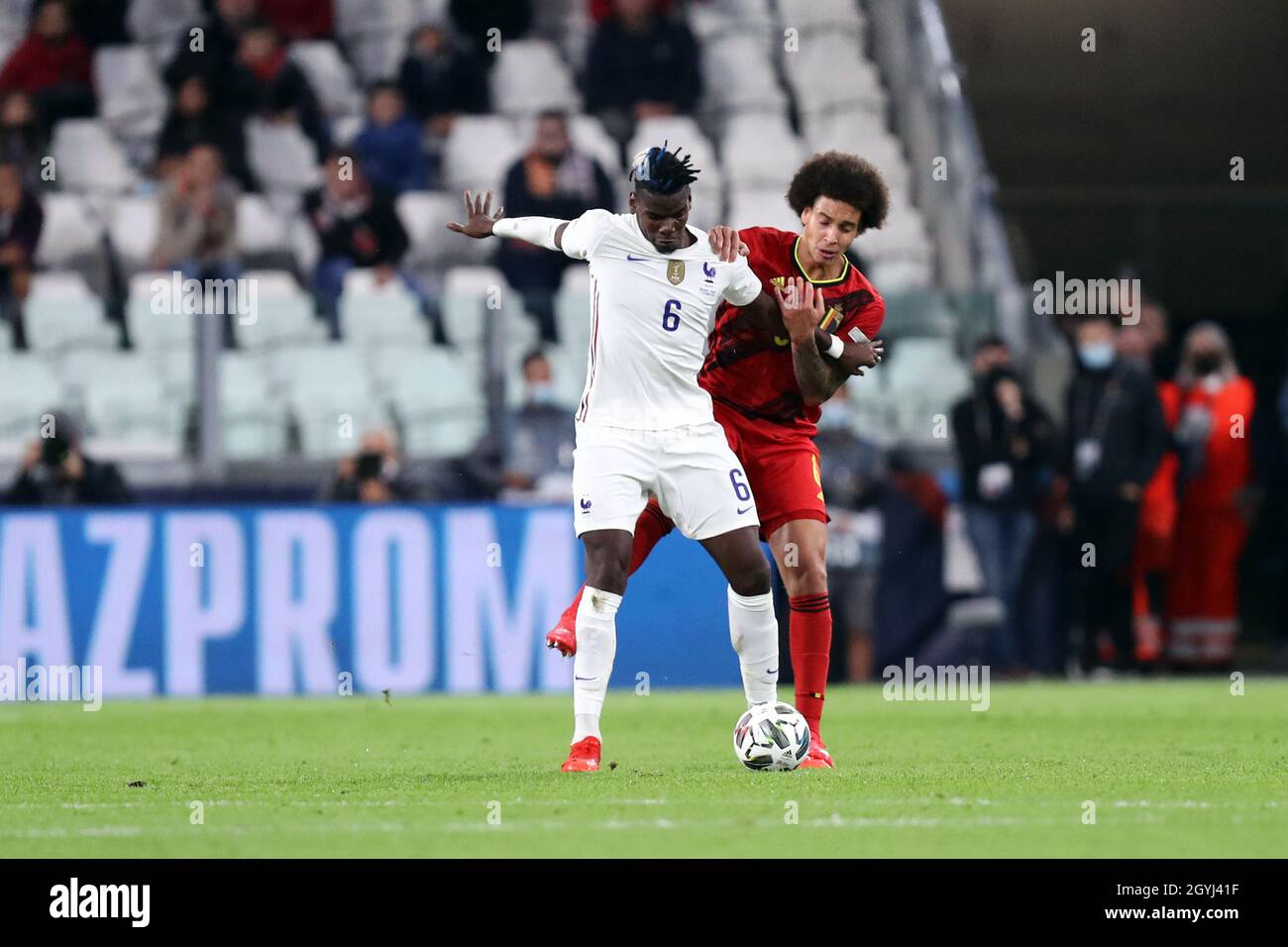 Paul Pogba  of France and Axel Witsel of Belgium battle for the ball during the Uefa Nations League semi-final  match between Belgium and France at Juventus Stadium on October 7, 2021 in Turin, Italy . Stock Photo