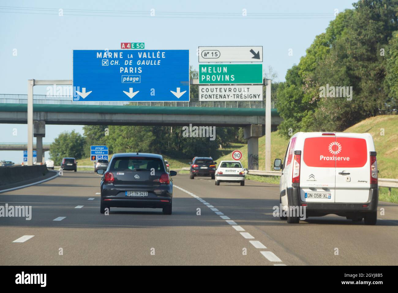 Melun – France, August 19, 2019 : Cars on the highway with roadsigns to Melun or Marne la Vallée Stock Photo