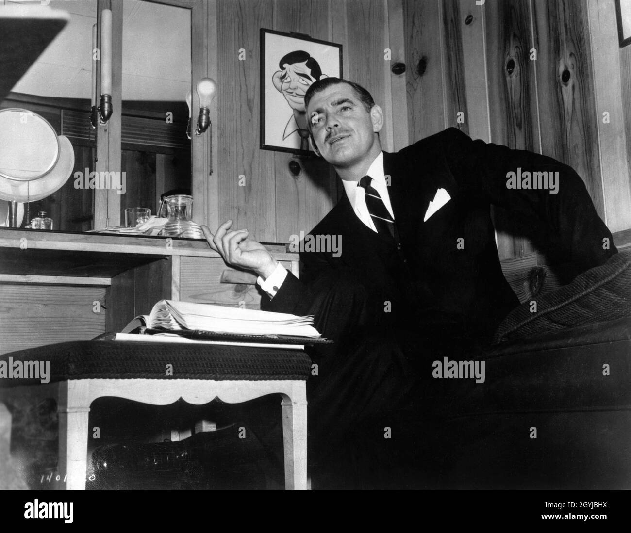 CLARK GABLE candid in his dressing Room during filming of THE HUCKSTERS