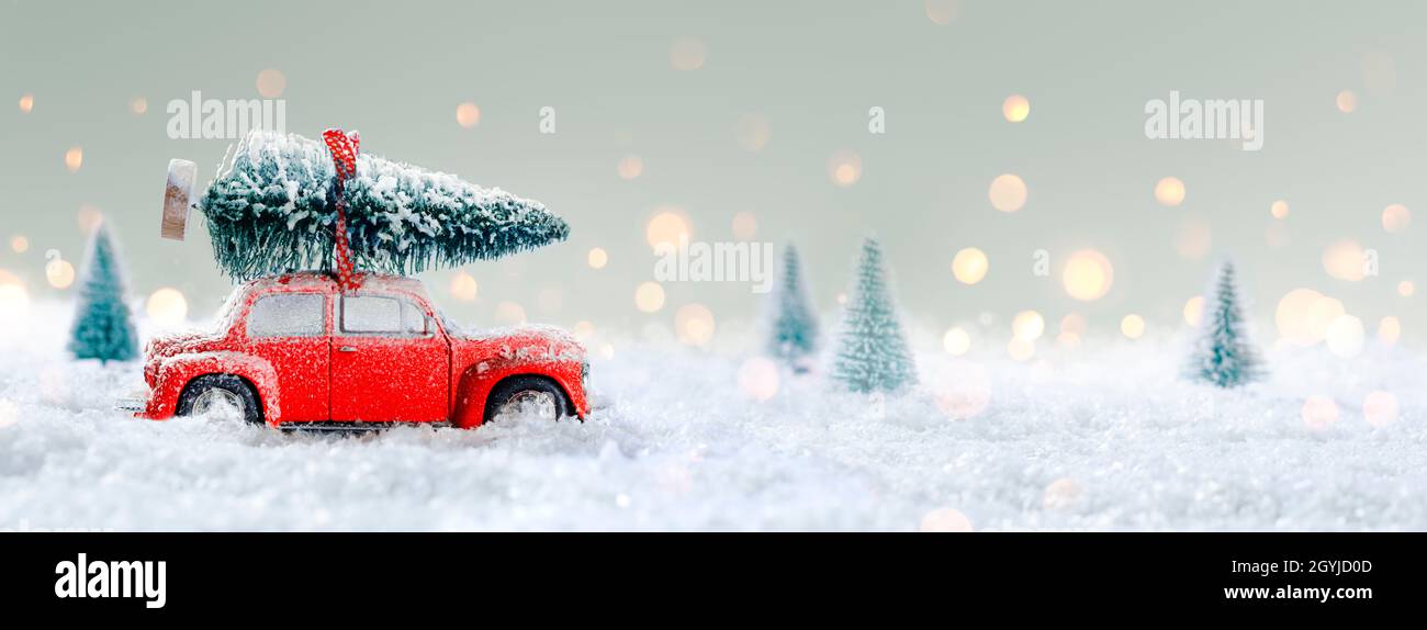 Deformed And Unrecognizable Car Carrying A Christmas Tree In Snowy
