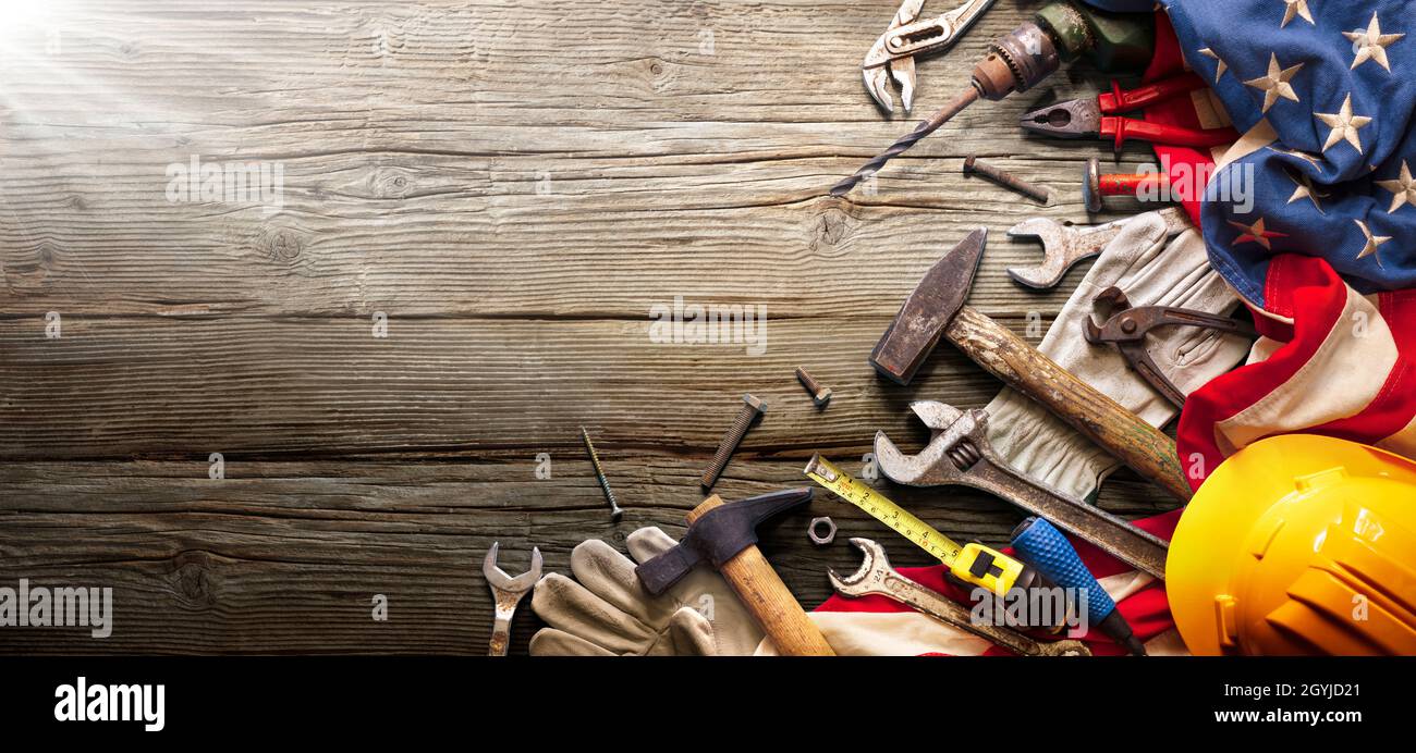 Labor Day - National Holiday - Construction Tools And Usa Flag On Wood Background Stock Photo