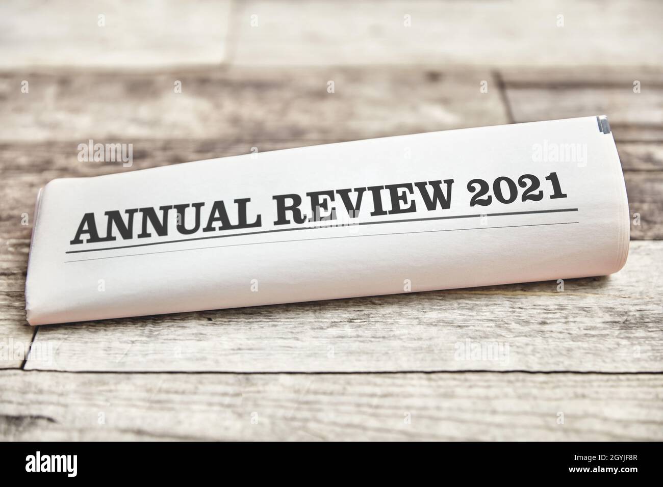 Annual Review 2021 as front page on folded newspaper Stock Photo