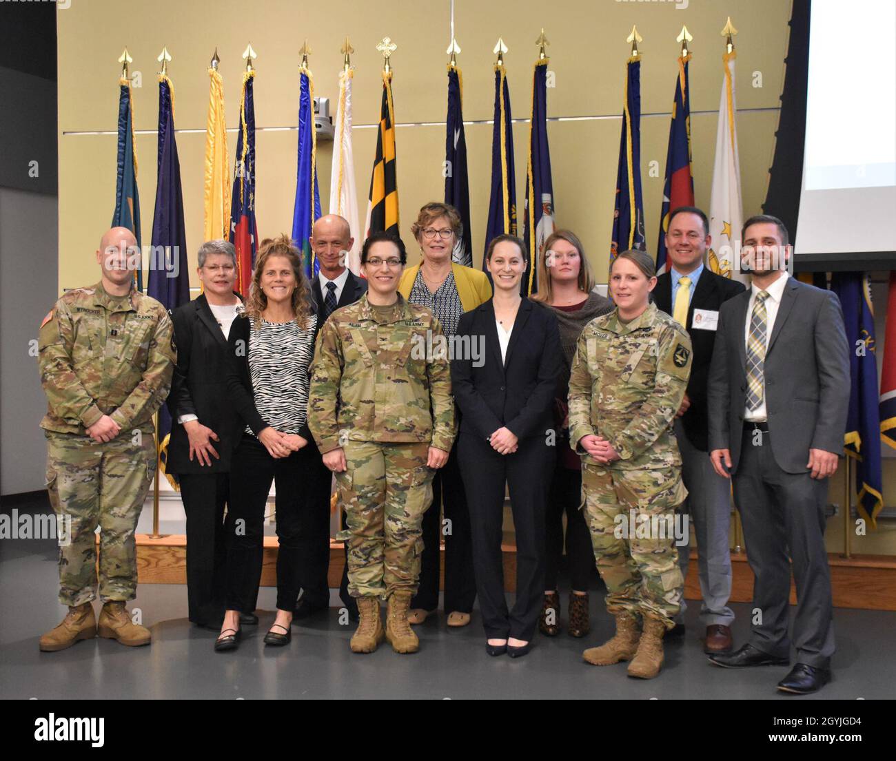 Members of the Warfighter Deployed Medical Systems Project Management Office and others who helped organize the 2020 Hospital Center Conversion Summit, gather for a photo. From left to right:  Army Capt. Scott Wynocker, Marie Cochran, Sage Norton, Stephen Matthews, Army Col. Gina Adam, Rene Smith, Lindsay Longobardi, Michelle Ehlert, Army Maj. Janessa Moyer, Timothy Hales, and Juston Donadieu. (Photo taken by Jeffrey Soares, USAMMDA Public Affairs) Stock Photo