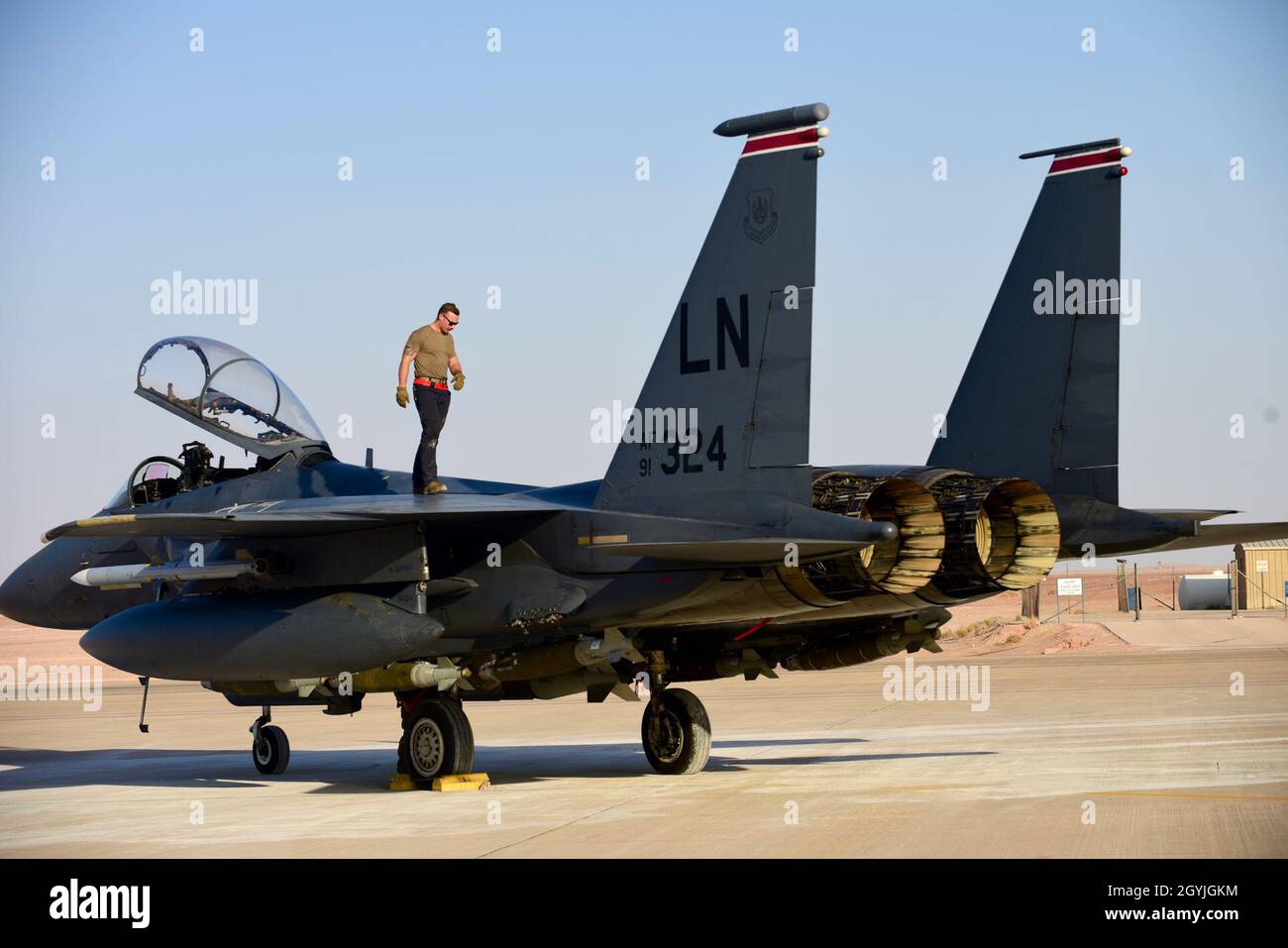 U.S. Air Force Staff Sgt. Zackary Suttles, a crew chief with the 378th Expeditionary Maintenance Squadron, conducts an inspection on an F-15E Strike Eagle at Prince Sultan Air Base, Kingdom of Saudi Arabia, Jan. 4, 2020. The F-15E Strike Eagle is a dual-role fighter designed to perform air-to-air and air-to-ground missions, demonstrating U.S. Air Forces Central Commands’ posture to compete, deter, and win against state and non-state actors.  (U.S. Air Force photo by Tech. Sgt. Michael Charles) Stock Photo