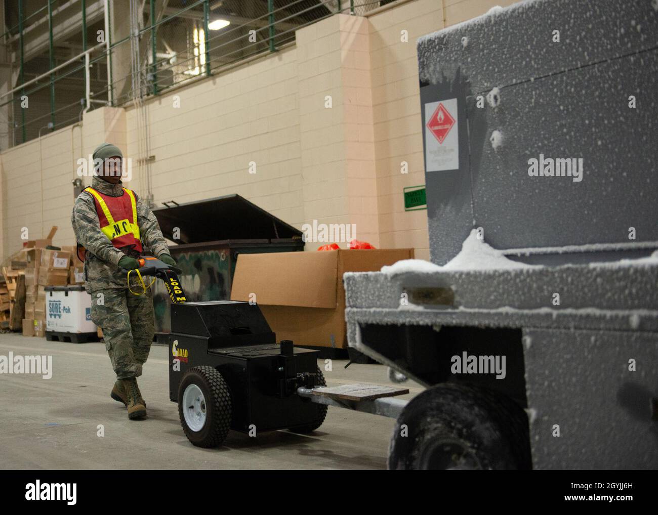 A U.S. Airman assigned to the 673d Logistics Readiness Group moves ...