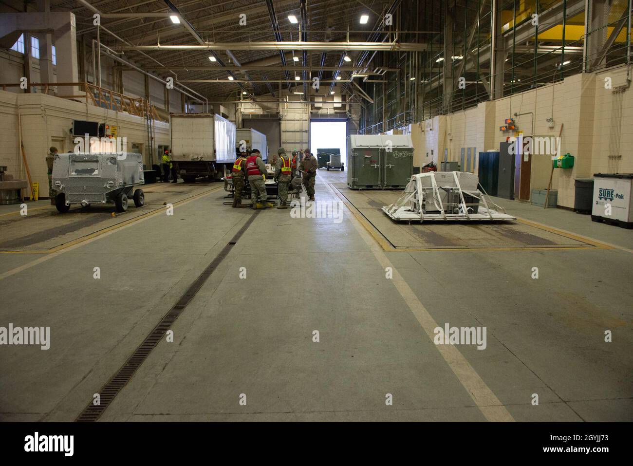 U.S. Airmen assigned to the 673d Logistics Readiness Group move ...