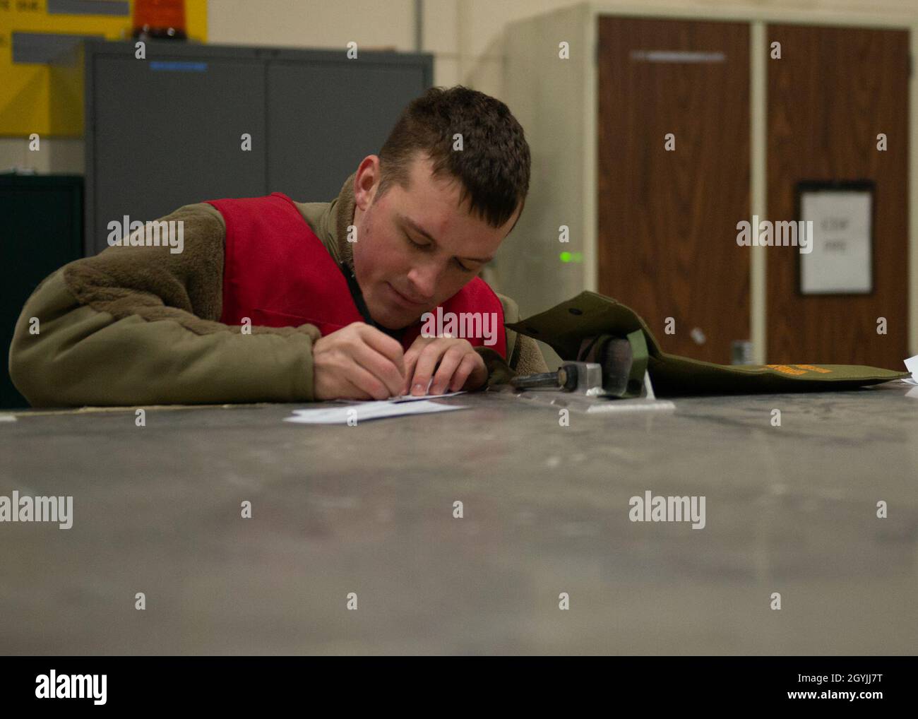 A U.S. Airman assigned to the 673d Logistics Readiness Group documents ...