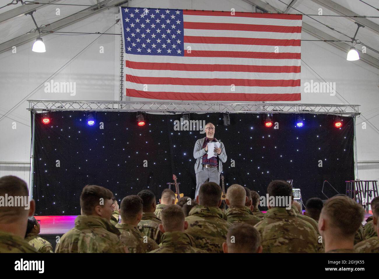 Matt Walsh, actor and comedian, performs standup comedy during the Chairman's annual USO tour show at Mihail Kogalniceanu Air Base, Romania, Jan. 7, 2020. The tour consisted of a show put on by celebrities and entertainers for Soldiers stationed on MKAB. USO performers volunteered to travel over the New Year to show service members that America remembers them and values their service. (U.S. Army photo by Spc. Ethan Valetski, 5th Mobile Public Affairs Detachment) Stock Photo