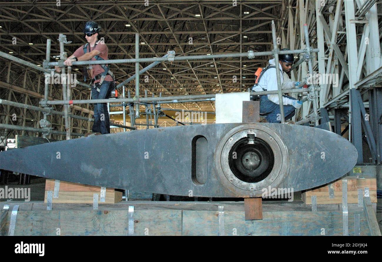 Shop 64A Shipwright Apprentices adjust a stanchion rig on the topside