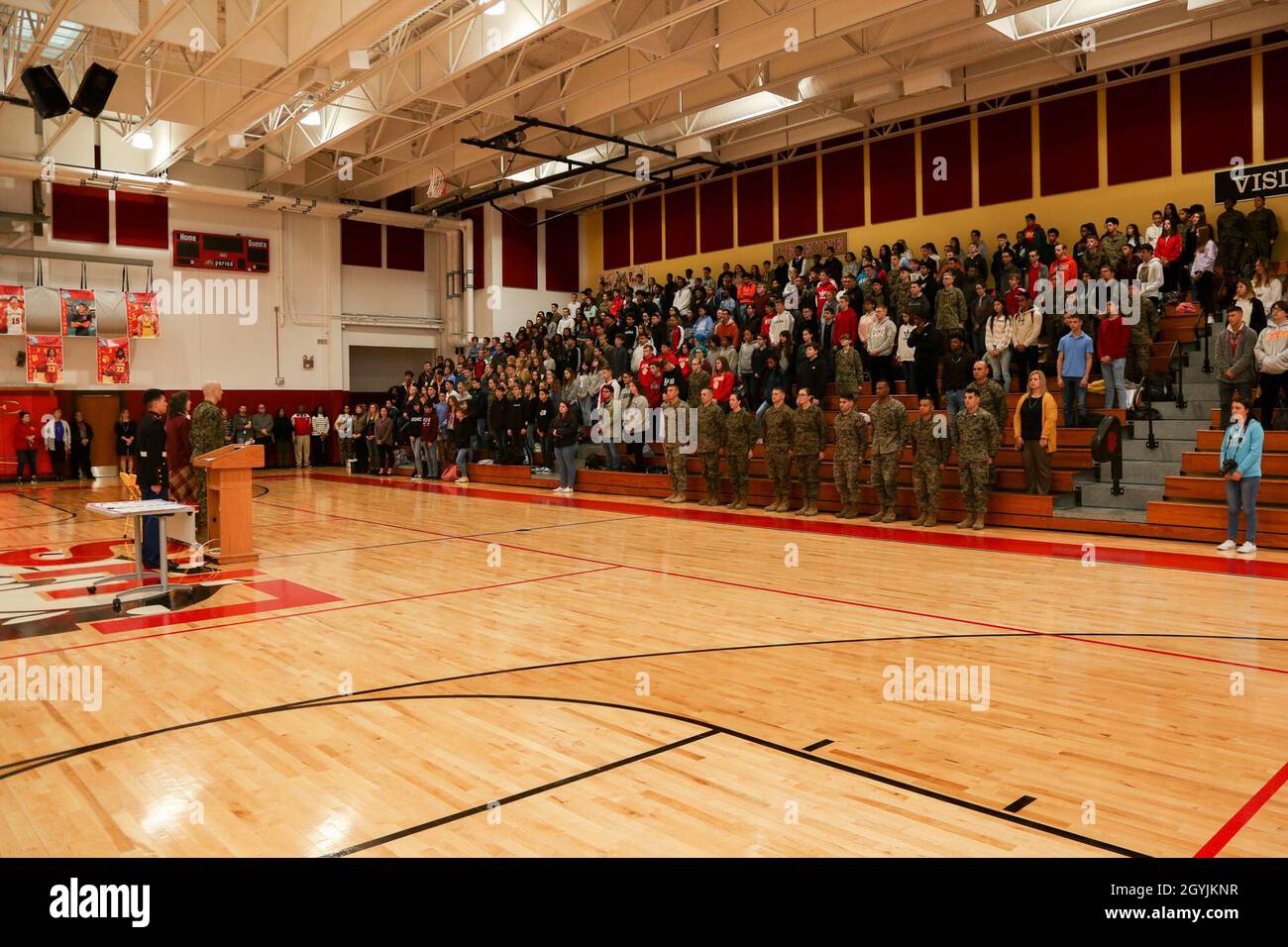 Students and staff of Lejeune High School stand with U.S. Marines with