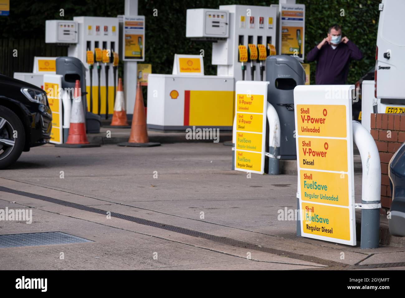 As the fuel crisis in the UK continues, this Shell petrol station is open for business, and motorists drive in with their cars to fill up with fuel, which is being sold at normal prices on 29th September 2021 in Birmingham, United Kingdom. While some forecourts remain closed with little or no fuel, there is confusion amongst the public as to whether they should buy fuel now or wait. This has led to panic buying and long queues outside some petrol stations as the crisis, which has been caused by a lack of HGV drivers available to deliver supplies, continues. Stock Photo
