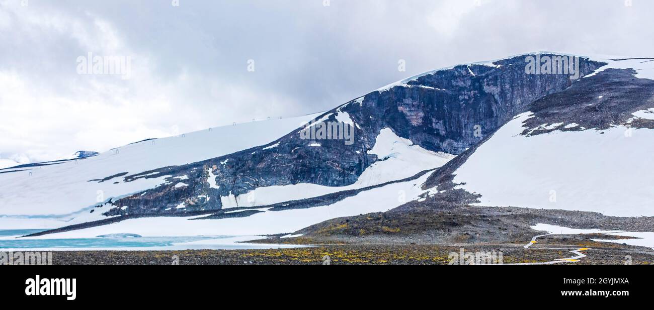 Galdhøpiggen snowcovered in summer in Jotunheimen Lom in Norway is the largest and highest