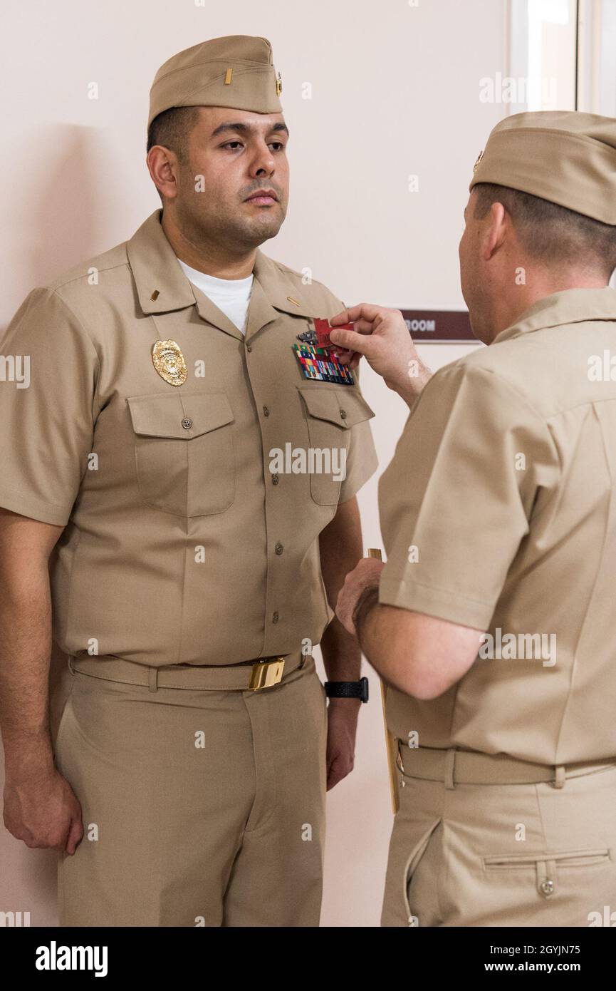 A student of Limited Duty Officer/Chief Warrant Officer (LDO/CWO) Academy  class 20030 at Officer Training Command Newport (OTCN) in Rhode Island,  receives a khaki uniform inspection,Jan. 8, 2020. The LDO/CWO community  supports