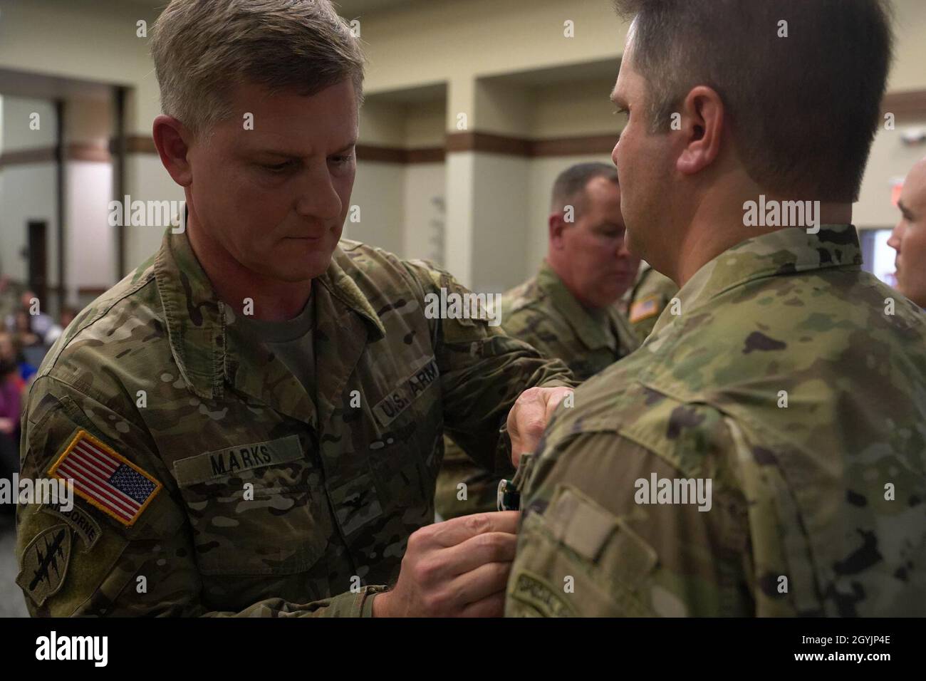 Col. Steven M. Marks, deputy commander, 1st Special Forces Command (Airborne) awards a Soldier from 2nd Battalion, 7th Special Forces Group (Airborne) in recognition of valorous acts during the Battalion’s recent deployment in support of Operation Resolute Support. The ceremony was held at Liberty chapel on Jan. 9. (Photo by Spc.Vargas, Jose) Stock Photo