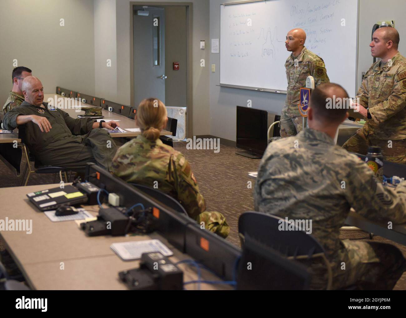 Maj. Gen. Brian Borgen, 10th Air Force commander, receives a mission brief from members of the 710th Security Forces Squadron at Buckley Air Force Base, Colo., Jan. 9, 2019. Borgen was briefed on some of the challenges that the 710th SFS faces that he might be able to help fix. (U.S. Air Force photo by Airman 1st Class Haley N. Blevins) Stock Photo
