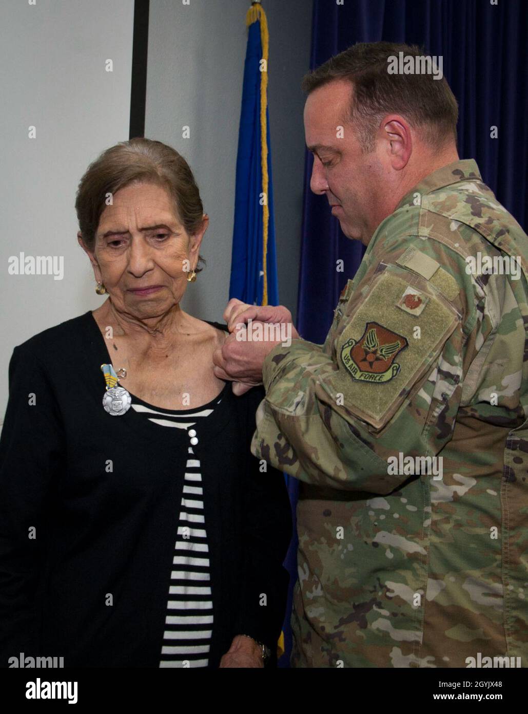 Mary O. Price is presented with a pin for the Award for Meritorious Civilian Service from Col. Robert Hoskins, director of personnel support, Air Force’s Personnel Center, Jan. 10, 2020 at Joint Base San Antonio-Randolph, Texas. Price retired after 52 years of dedicated service. Stock Photo