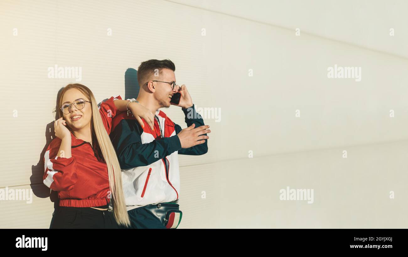 Young man and woman talking on their mobile phones Stock Photo