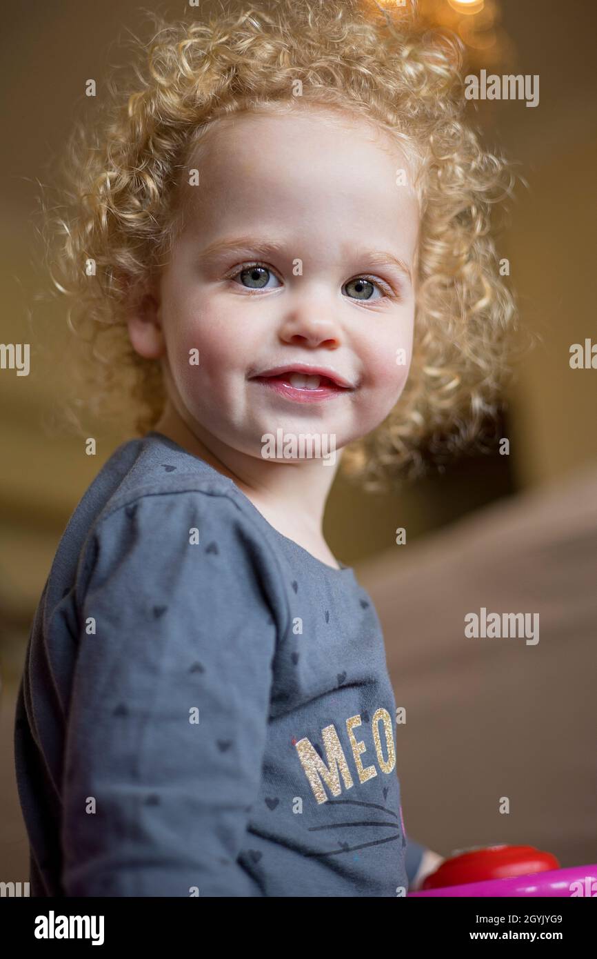 Curly haired young girl Stock Photo