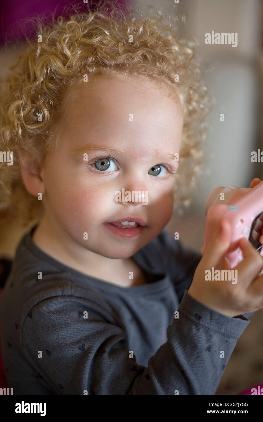 Curly haired young girl Stock Photo