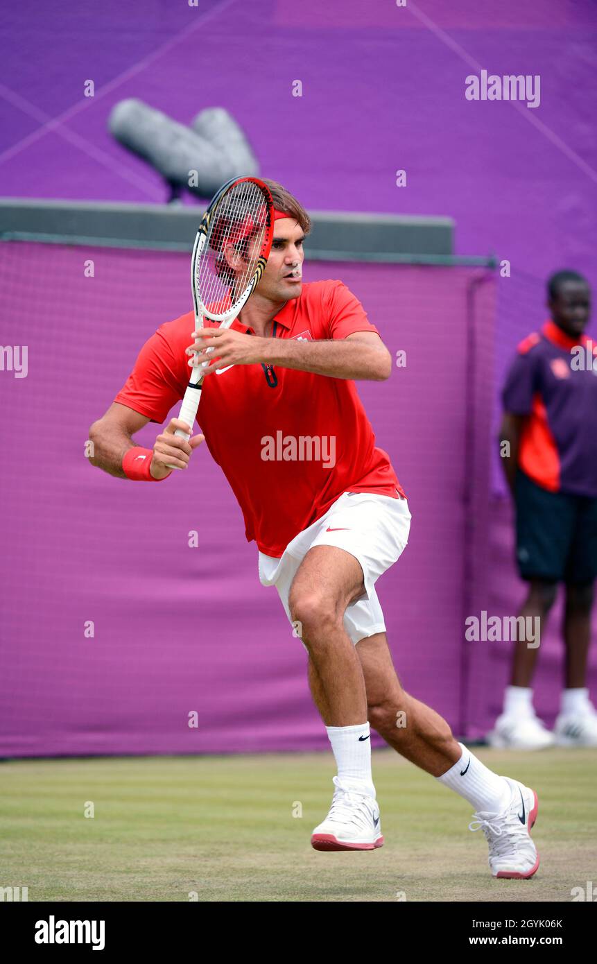 Roger Federer competing in the 2012 London Olympics at Wimbledon, which served as the tennis venue. Stock Photo