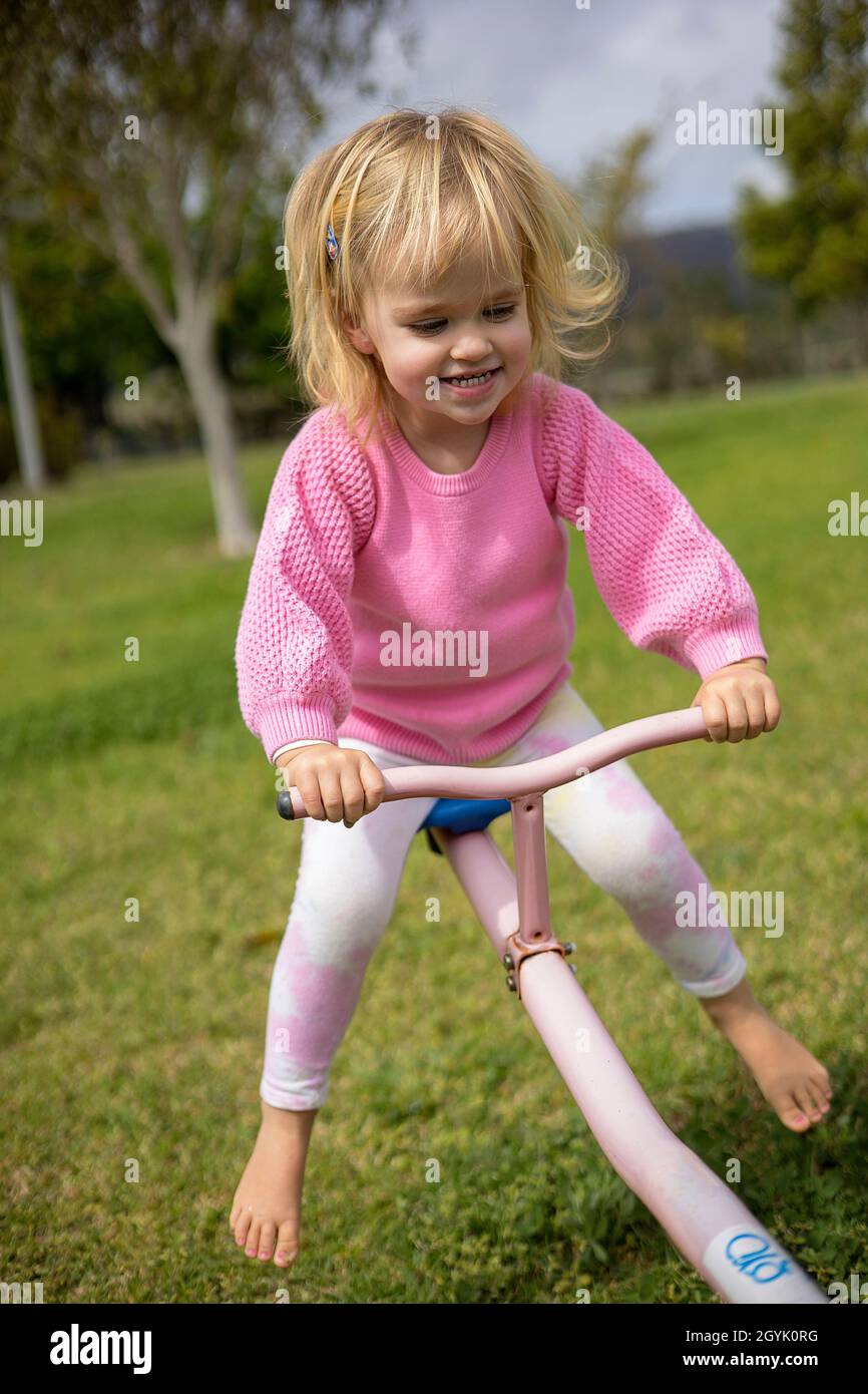 Young Blond Girl On A See saw Stock Photo Alamy young-blond-girl-on-a-see-saw-stock-photo-alamy